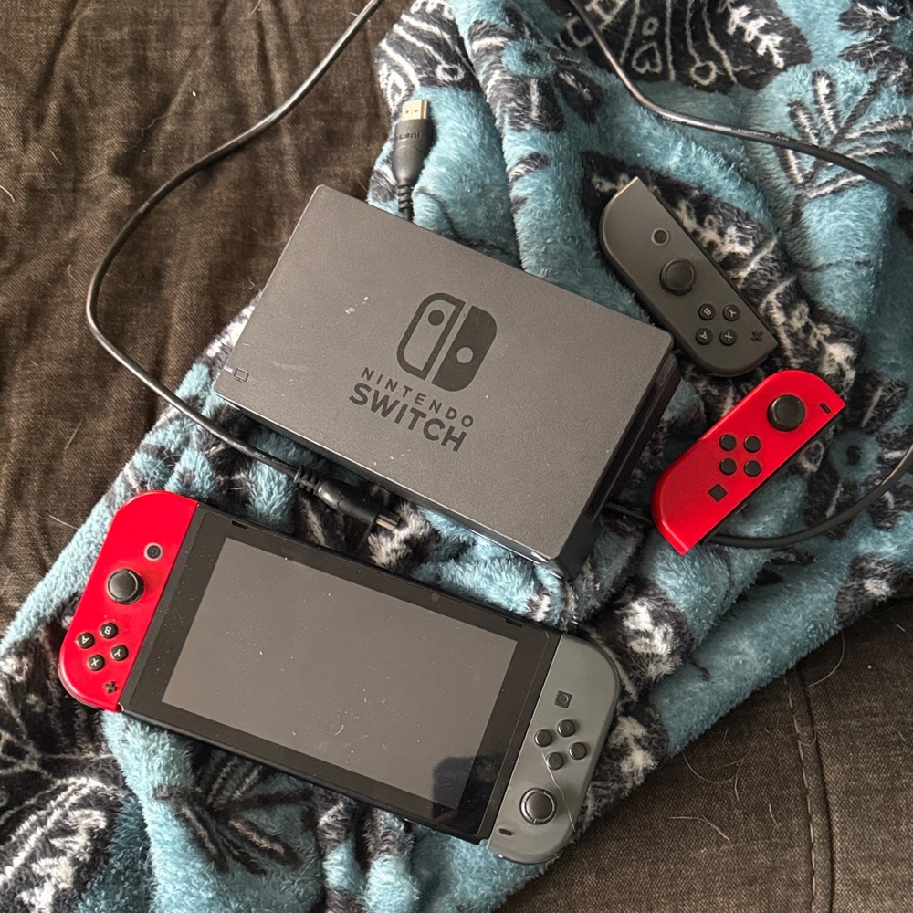 Nintendo Switch with Red and Gray Joy-Con Controllers